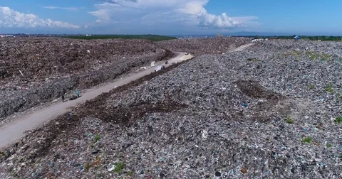 Aerial shot of a huge trash dump site between Kuta and Sanur, Bali 스톡 동영상 76955239