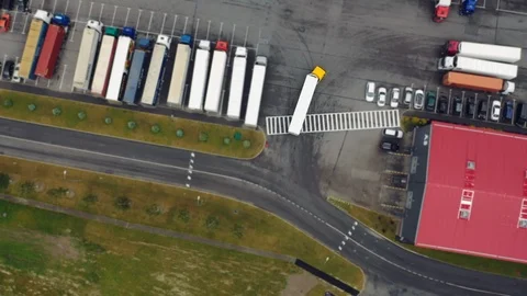 Aerial Shot of Industrial Warehouse Loading Dock where Many Truck with Semi Stock Footage