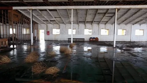 Aerial shot of the inside of an abandoned warehouse Stock Footage 72562427