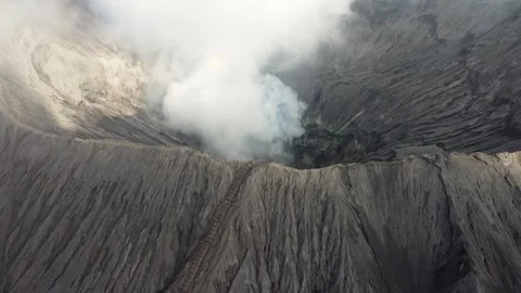 Aerial shot inside the Bromo Vulcan in Cemoro Lawang, Indonesia 4K Stock Footage 272599094