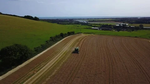 Aerial shot jib zoom in shot combine harvester Stock Footage 79727962