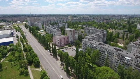 Aerial shot of Kherson city buildings divided by a long and modern prospect Stock Footage