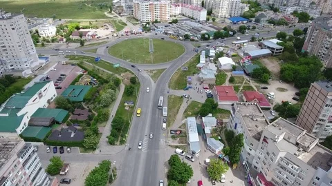 Aerial shot of of Kherson with its modern buildings and a round intersection Stock Footage