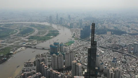 Aerial shot of Landmark 81 and Ho Chi Minh City downtown Stock Footage