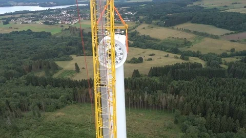 Aerial shot of a large crane on a wind turbine construction site. Stock-Footage 73123674