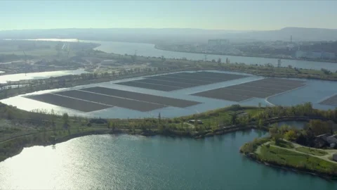 Aerial shot of the largest solar panel farm floating on a lake, Orange, France Stock Footage 292809111