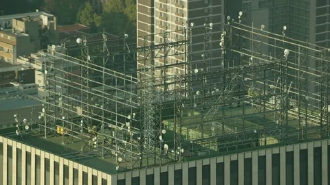 Aerial shot of a lighting grid on top of a building Stock Footage 80677393