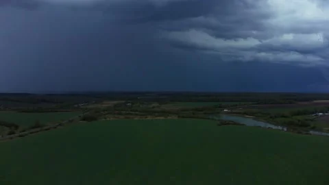 Aerial shot: Lightning Over The Field Into the Thunderstorm Stock Footage 132801645