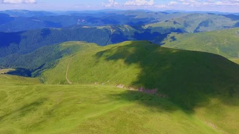 Aerial shot of long ranges with cloud shadesin the Carpathians in summer Stock Footage 93505596