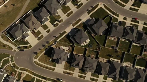 Aerial shot looking down on dense suburban housing development with park Stock Footage 130667507
