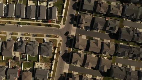 Aerial shot looking down on dense suburban housing development Stock Footage 146924642