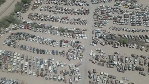 Aerial Shot looking down at enormous breakers yard Stock Footage 192593663