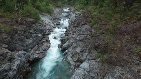 Aerial Shot Looking Down Flying Through Rocky River Canyon With White Water Stock Footage 71182704