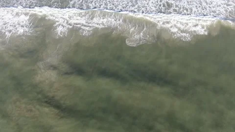 Aerial shot looking down on ocean waves Stock Footage 201679065