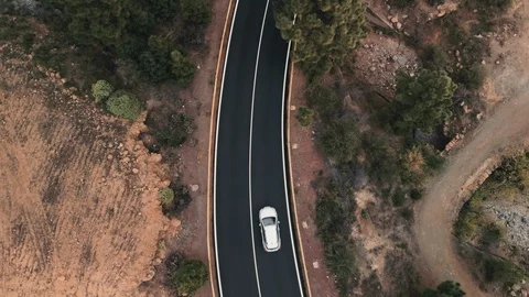 Aerial shot. Looking down. takeoff camera over the treetops. cars are driving a Stock Footage 103423498