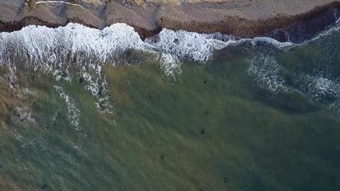 Aerial Shot looking down on waves and cliffs, Point Reyes Stock Footage 94959361