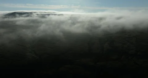 Aerial shot of low hanging clouds over the hills Video stock 312229643