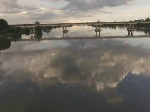 Aerial shot low level of a river with mirror cloud, aerial shot above the river Stock Footage 77342011