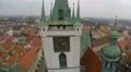 Aerial shot of main clock on old city hall tower, beautiful city with red roofs 4k or 4k+ Resolution