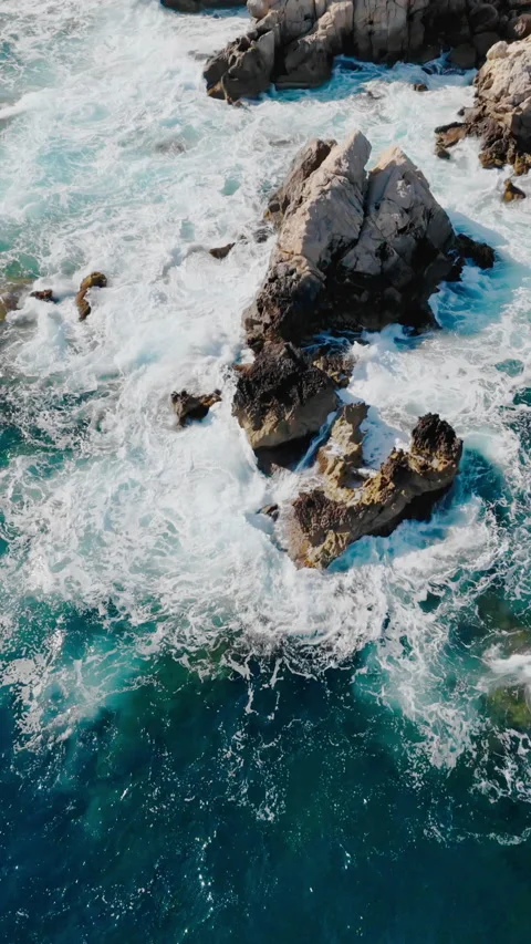 Aerial shot of Mediterranean coastline with dramatic wave impact Stock Footage 337778158