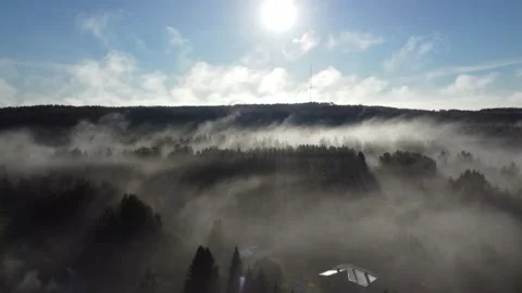 Aerial shot of misty morning with sunrays Stock Footage