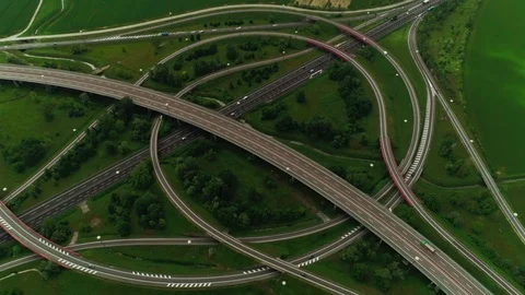 Aerial shot modern multi level highway busy with moving car surrounded by Stock Footage 111220577