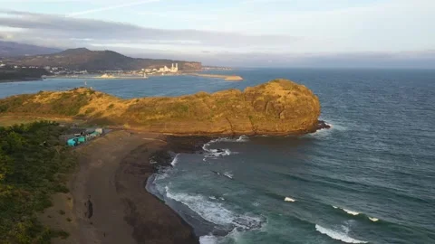 Aerial shot of mountain, cliffs and seaside village,Jeju Island,South Korea Stock Footage 245953919