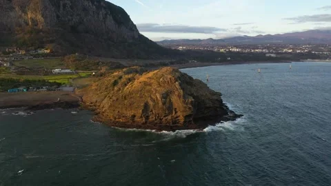 Aerial shot of mountain, cliffs and seaside village,Jeju Island,South Korea Stock Footage 245953922