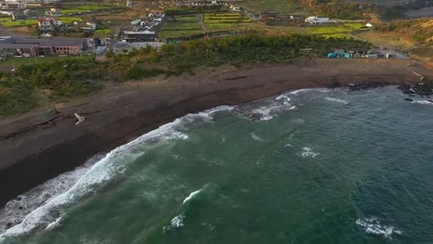 Aerial shot of mountain, cliffs and seaside village,Jeju Island,South Korea Stock Footage 245953929