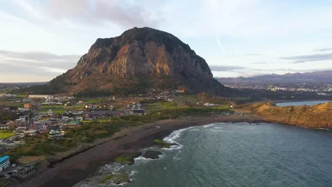 Aerial shot of mountain, cliffs and seaside village,Jeju Island,South Korea Stock Footage 245953937