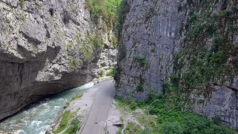 Aerial shot of mountain river and road in gorge Stock Footage 101068047