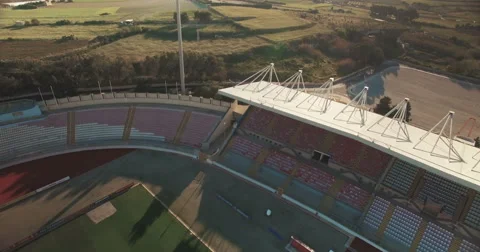 Aerial shot - Moving backwards over a European Football Soccer Stadium Stock Footage 61772566
