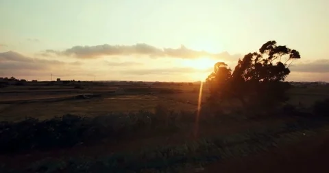 Aerial shot moving backwards over farms Stock Footage 75168515