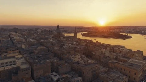 Aerial shot moving backwards at Sunset in Valletta, Malta Stock Footage 90684630
