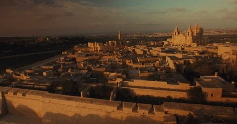 Aerial shot moving sideways looking at the church in Mdina Stock Footage 73470177