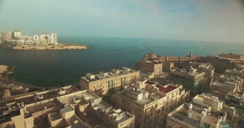 Aerial Shot - Moving sideways over a City by the Sea Stock Footage 61347521