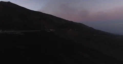 Aerial shot moving towards Mount Etna at Dusk Stock Footage 77100437