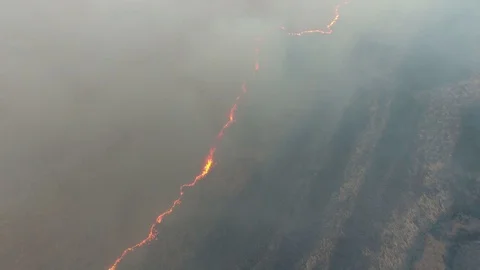 Aerial shot of a natural fire and smoke disaster in the Dnipro basin in spring Stock Footage