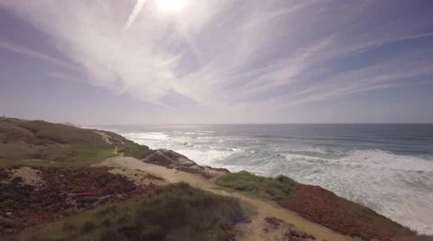 Aerial shot of ocean front cliffs in Praia de Santa Cruz - Portugal Stock Footage 64630980