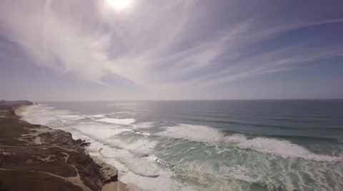 Aerial shot of ocean front cliffs in Praia de Santa Cruz - Portugal Stock Footage 64632514