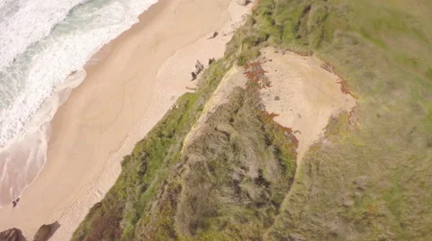 Aerial shot of ocean front cliffs in Praia de Santa Cruz - Portugal Stock Footage 64648378