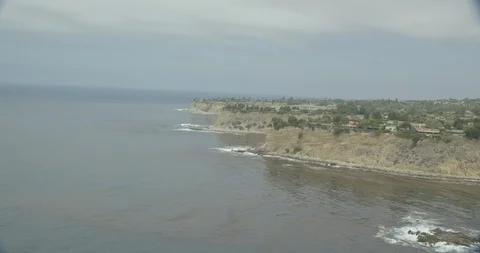 Aerial shot of oceanside cliffs, cloudy day Stock Footage 105544218