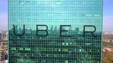 Aerial shot of office skyscraper with Uber Technologies Inc. logo. Modern office Stock Footage 74297437