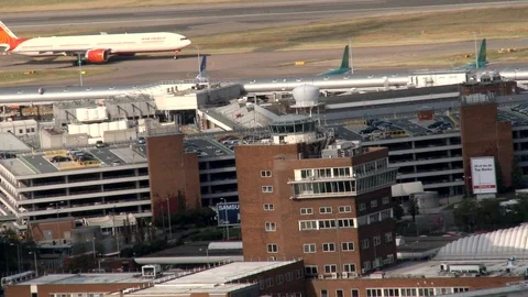 Aerial shot, Old Control Tower At Heathrow Airport &amp; Runway 스톡 동영상 107095532