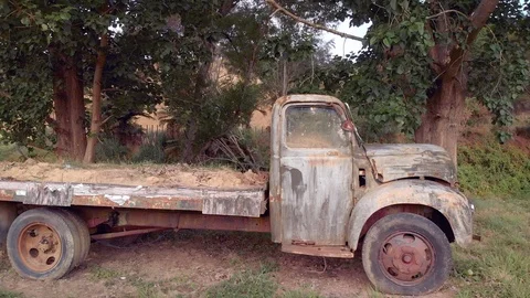 Aerial shot of an old rusty abandoned truck Видео 124396746