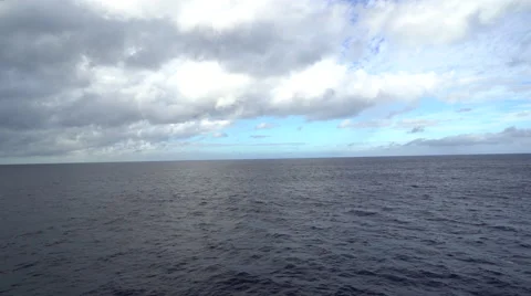 Aerial shot of open ocean. Blue sky and horizon. Stock Footage 60953874