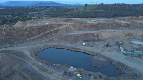 Aerial shot of an open-pit mine quarry with industrial machinery Video stock 342518628