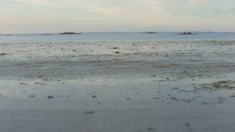 Aerial shot over the beach heading out to sea, in Brittany, France Stock Footage 195218816
