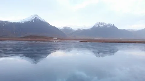 Aerial Shot Over Cabin Between Lake And Mountains In Iceland Stock Footage 120263402