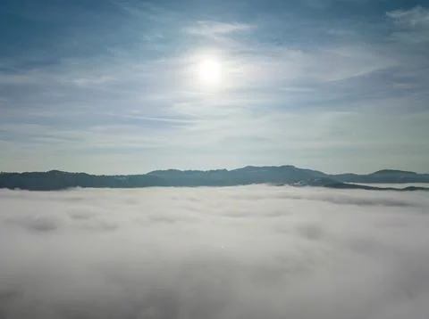 Aerial shot over the clouds while sunrise sky. Foto stock